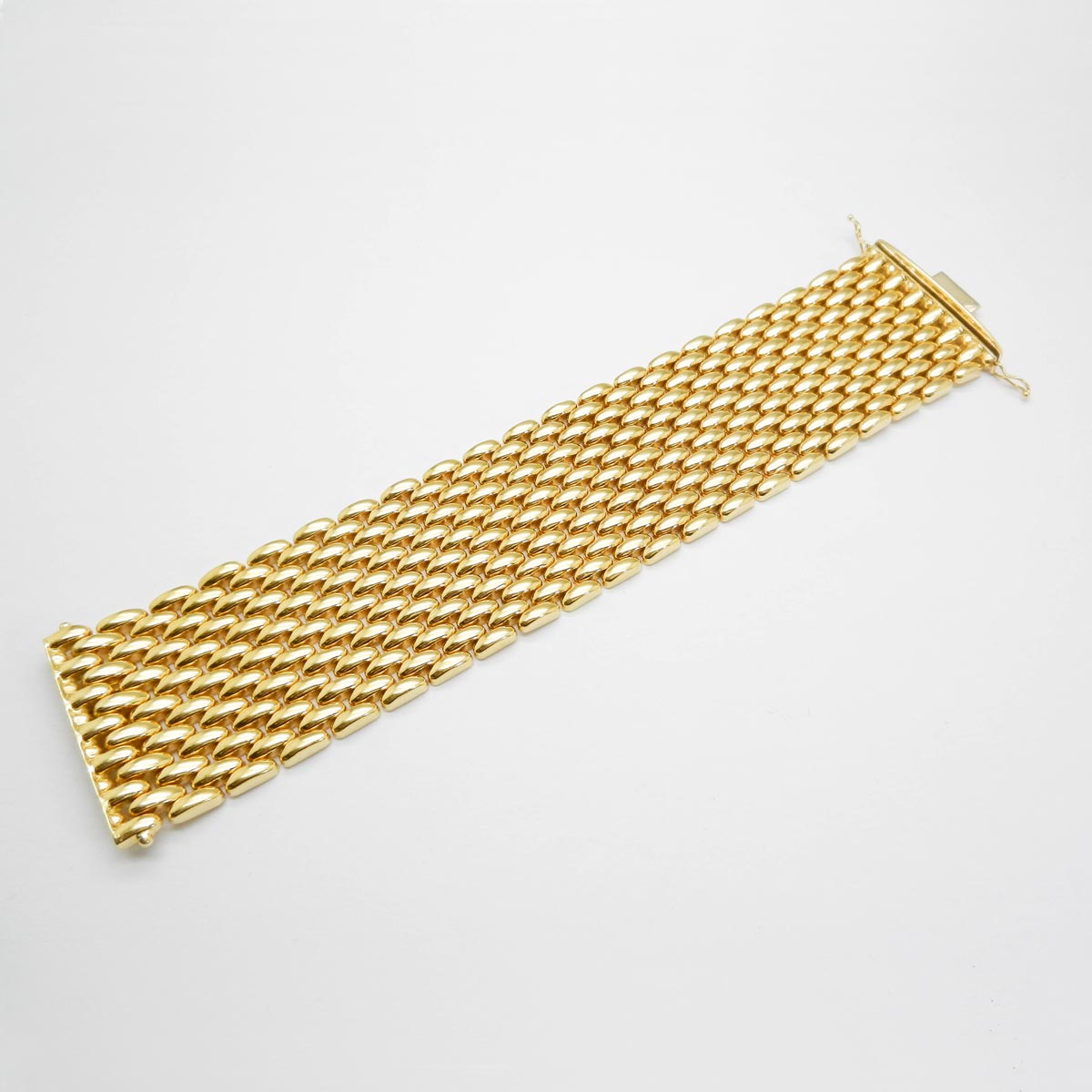 Bracciale a maglia alto in oro giallo